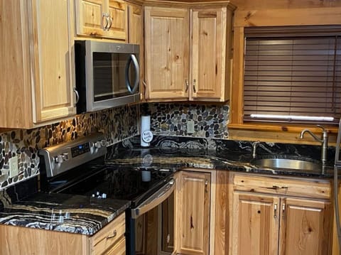 All new kitchen. Hickory cabinets, granite counters and Stainless steel appliances.