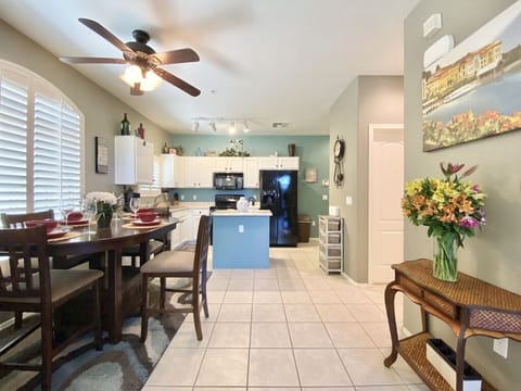 Dine-in while gathered around the bar height dining table and chairs.