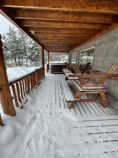 Side deck with picnic tables and hot tub
