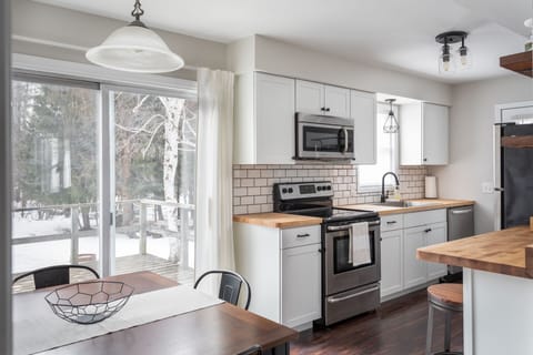 Enjoy views of nature from the kitchen and dining area.
