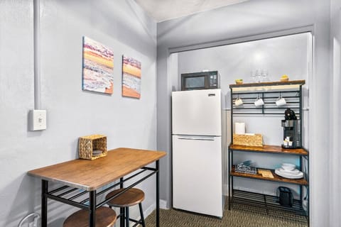 Boutique Beach Retreat open concept kitchenette, refrigerator/freezer, coffee bar, with kitchen basics, and seating area