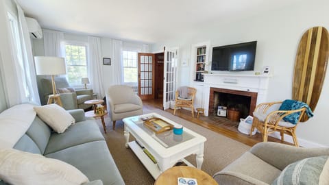 Living room with comfortable furniture and flat screen TV