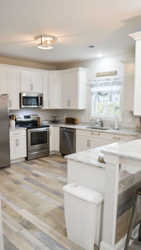 The kitchen has granite countertops and stainless steel appliances!