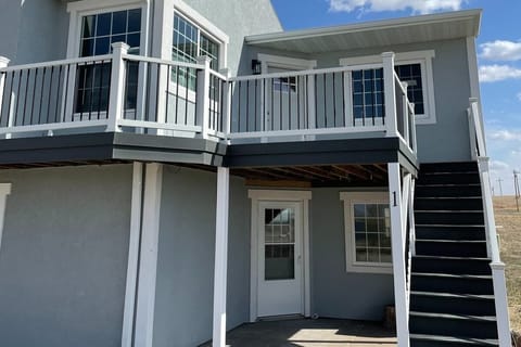 Front View of Condo 1.  Not pictured is BBQ Grill and outdoor chairs stored under stairs.