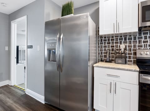 From the dual-basin sink to the built-in microwave and ice-dispensing fridge, every detail of this kitchen has been thoughtfully curated for convenience.
