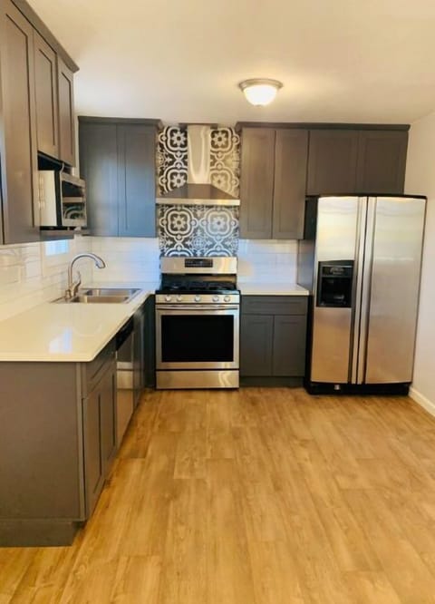Beautiful kitchen with stainless steel appliances. 