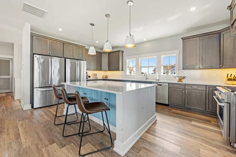 Modern Kitchen with Bar Seating on Third Level
