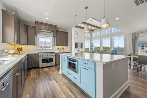 Modern Kitchen with Bar Seating on Third Level