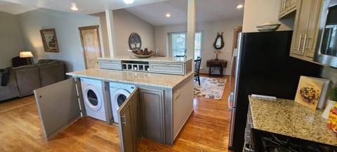 Fullsize Washer and Dryer under the kitchen cabinet counter.