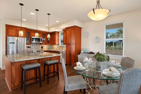 Gather for island-style meals in the open-concept dining space, perfectly designed for entertaining and connection.
