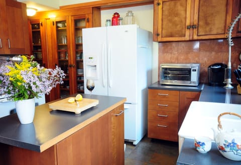 Coffee maker and Keurig available, along with plenty of dishes and silverware