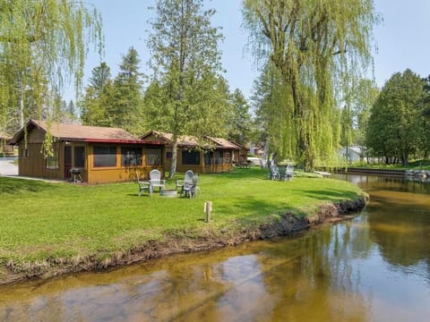 View of cabin sitting on river