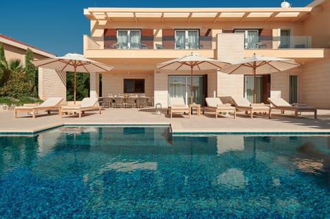 Luxury Croatia sea view villa with private pool surrounded by deckchairs and sundeck for vacation