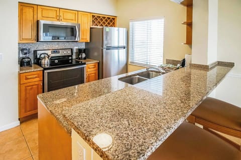 Full kitchen. Stove, Oven, Microwave, Dishwasher, Blender, Coffee Pot, Kettle, and a Full Refrigerator.