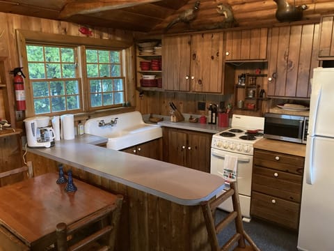 Main cabin: well-equipped and open-concept kitchen with large peninsula.