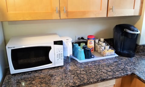 Well stocked kitchen with microwave, Keurig coffee maker, water filter, etc