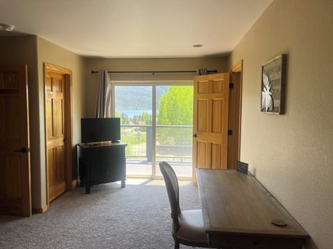 Master bedroom with slider and lake views