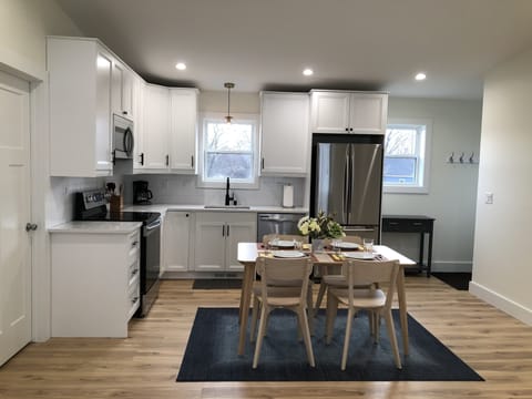 View of kitchen from living room area. Cook, bake, or let DoorDash handle it!