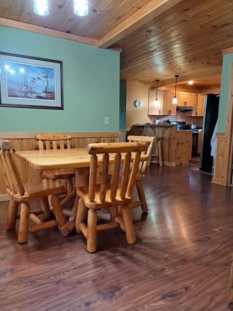 From entryway into cabin, welcome to our dining area. Bedroom to the right.