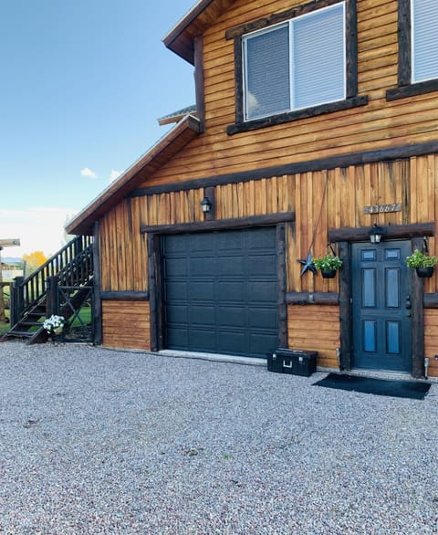 Parking in front of this garage door and stairs leading up to the rental space 