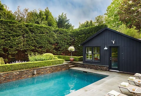 VIew of pool and pool house from spa