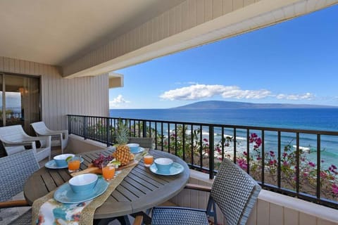 Enjoy breakfast on your private balcony with sweeping views of the Pacific and distant islands