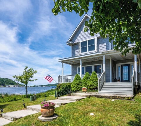 EXTERIOR:  Another view of the front of the house, with Betsie Lake in the background.