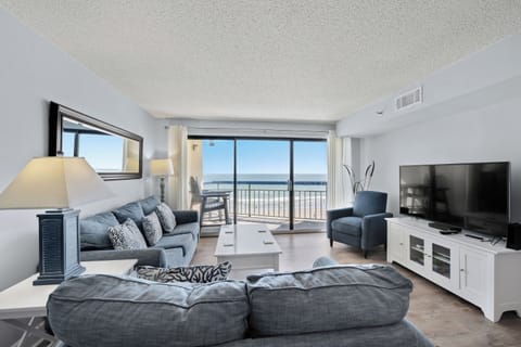 The ocean front living room is well-appointed with comfortable furnishings.