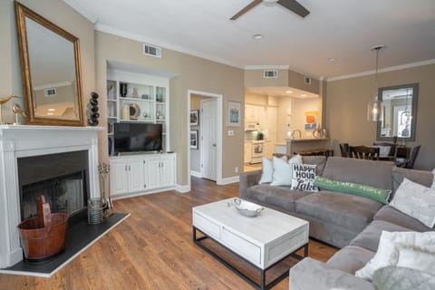 Living room with pull out couch and fireplace overlooking the lake