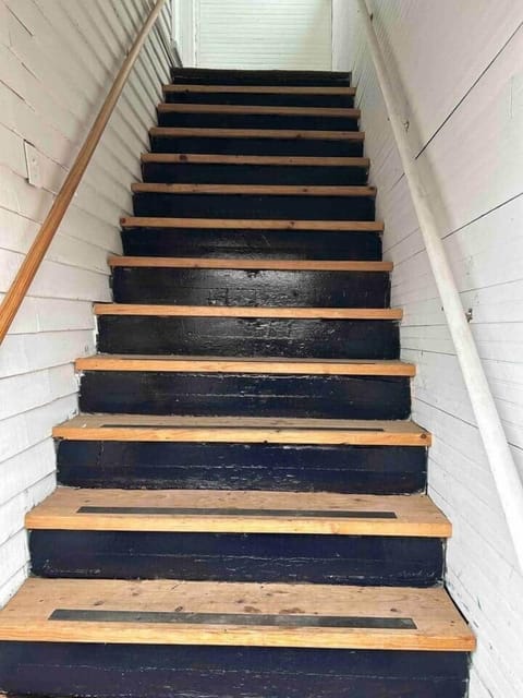 Steep staircase leading up to Quirky and Cozy Duplex
