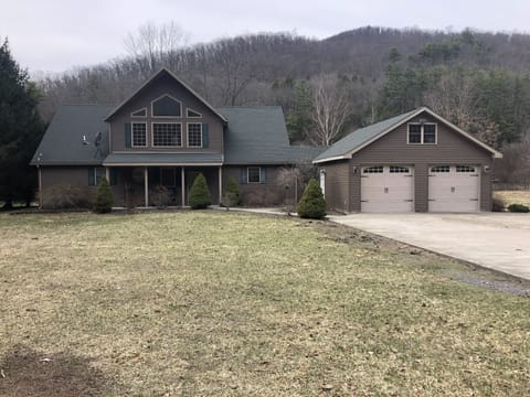 Front view of home.  The Pine Creek Rail Trail borders the front.