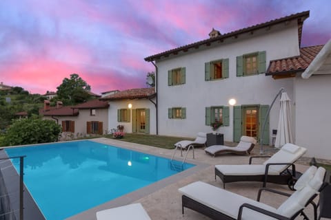 Pool and the back yard in sunset
