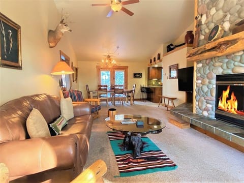 Cozy yourself in front of our wood fireplace in the Living Room