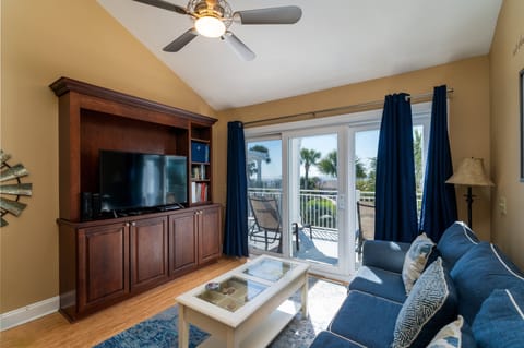 This Atrium Villa has an open floor plan with ocean views visible from multiple sliding doors leading to the deck.