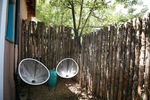 Back courtyard with seating for 2