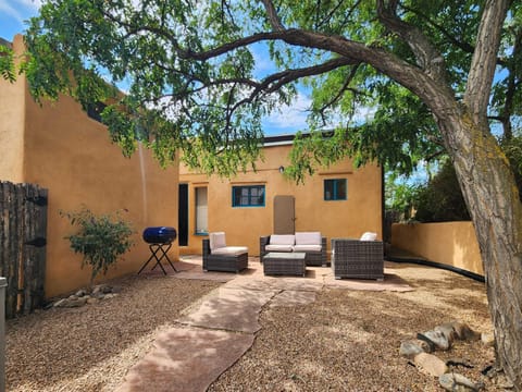 Back courtyard with ample seating and BBQ grill