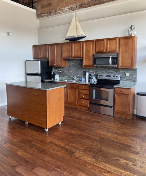 Kitchen island on casters can be moved. 