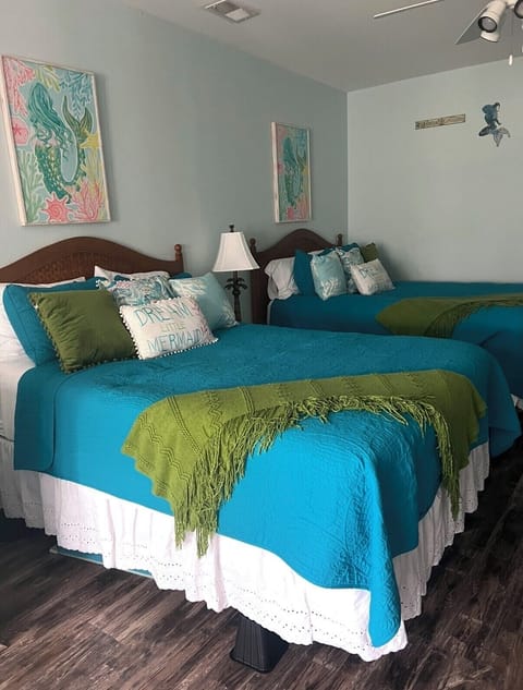 Two queen size beds in the mini unit.