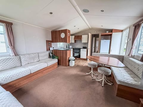 Spacious living and dining area with cozy natural light