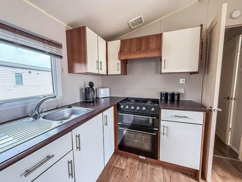Bright, modern kitchen with ample counter space and natural light