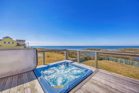 Soak in bubbling jets while watching ocean waves and endless blue skies from your private hot tub oasis.