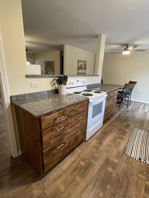 Kitchen looking into living room & dining area 