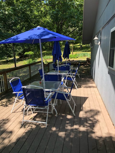 Spacious Deck with seating for the entire family to  enjoy the shaded outdoors. 