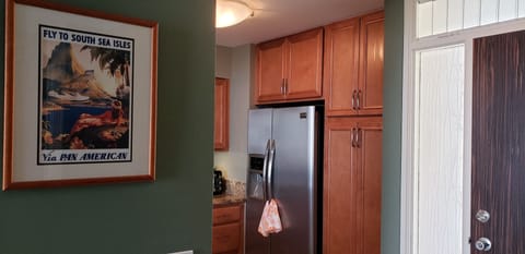 Large refrigerator with ice maker and water.  Lovely art throughout the condo.