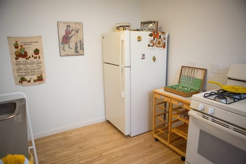 Kitchen with full-size fridge and gas oven