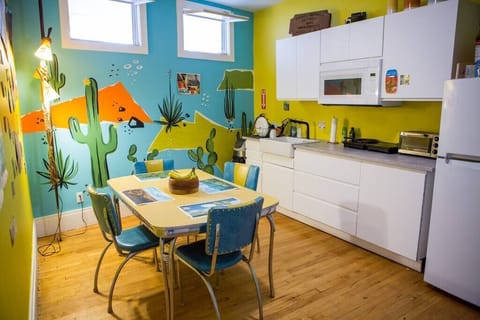 Our updated, modern communal kitchen, complete with microwave, induction burner cooktops, toaster oven and coffee maker.