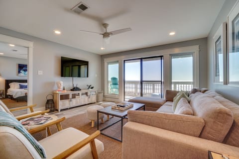 Unwind in your spacious living room with plush seating, modern entertainment, and stunning ocean views from your private balcony.