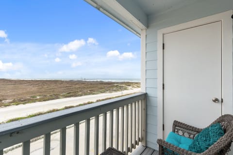 Sip your morning coffee in this cozy wicker chair while gazing across endless coastal marshlands from your private covered balcony.