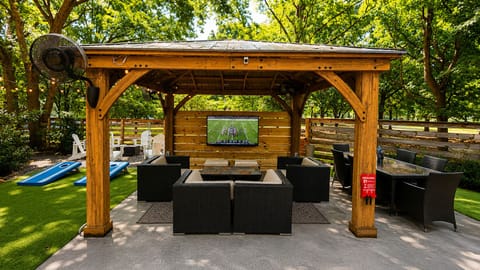 Resort Style Backyard
• Covered gazebo with 65" Smart TV and fans
• Outdoor Bar with Seating for 6 and mini-beverage refrigerator
• Gas grill
• Outdoor dining table with seating for 6
• Multiple lounge areas
• Cornhole, Giant Jenga, and outdoor games
