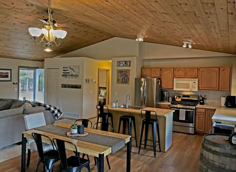 Open concept dining room, kitchen, and living room.